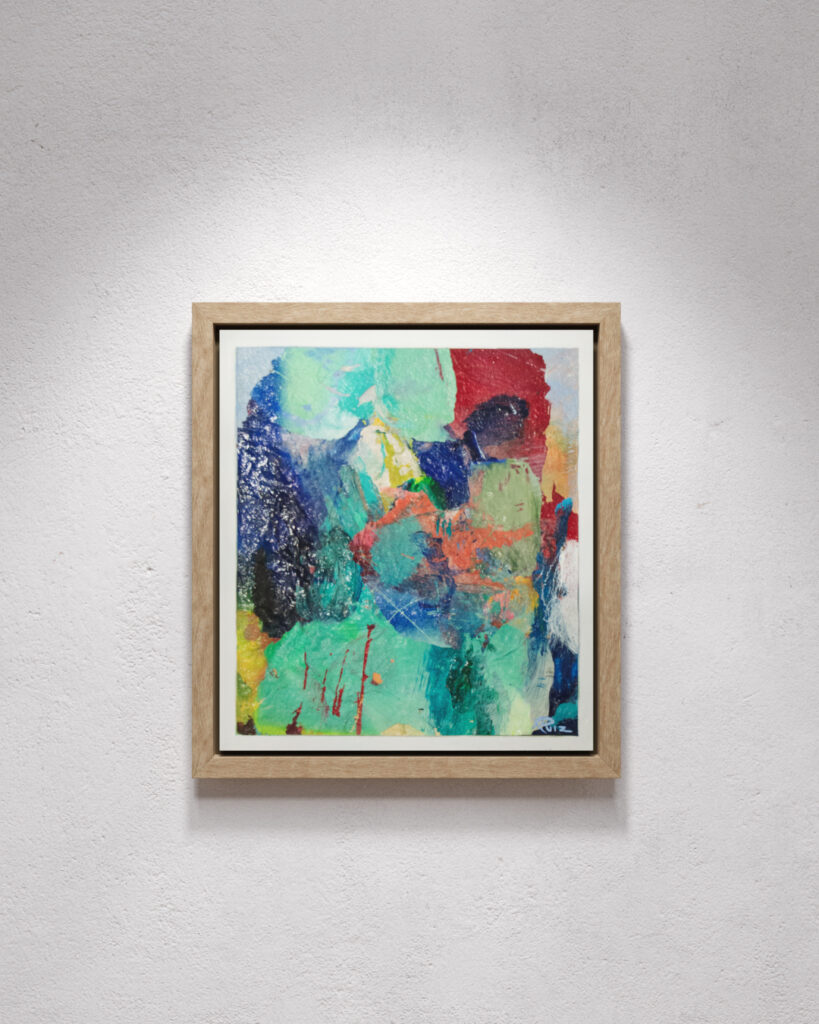 display of small abstract painting haning on a white wall